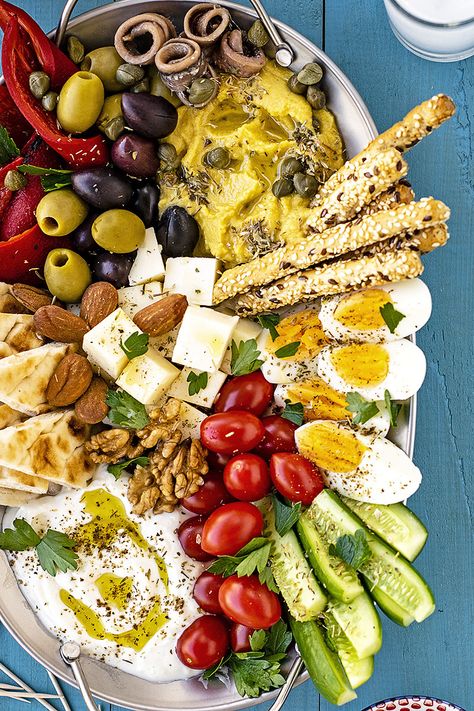 Learn how to make a Greek meze platter and spend a cozy night with your friends eating, drinking, laughing, and having fun! Serve with wine, ouzo, or tsipouro. #Greek #meze #mezze #platter #party #mediterranean Greek Meze Platter, Olives Recipes, Platter Party, Greek Meze, Meze Platter, Mezze Platter, Mediterranean Appetizers, Apple Crisps, Friends Eating