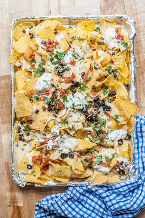 Sheet Pan Queso & Chicken Nachos Recipe | eHow Shredded Chicken Leftovers, Best Nachos, Queso Chicken, Mexican Food Recipes Appetizers, Sheet Pan Nachos, Pan Nachos, Chicken Nachos Recipe, Nachos Recipe Easy, Recipe Sheets