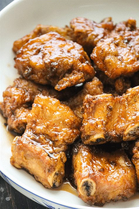 Dad's Fried Pork Ribs with Black Vinegar are fried until crisp on the outside and juicy on the inside, then tossed in a sweet, savory and tangy glaze! #blackvinegarpork #vinegarpork #chineseporkribs Korean Pork Ribs, Fried Pork Ribs, Asian Ribs, Asian Pork Recipes, Black Vinegar, Honey Pork, Pinoy Recipes, Pork Spare Ribs, Asian Pork