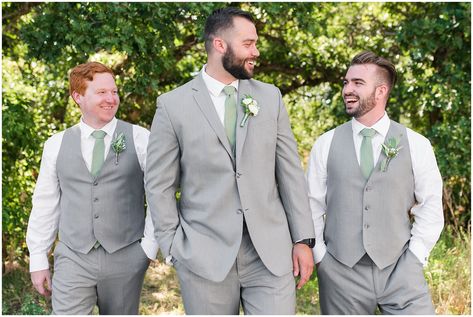 Wedding party in woods wearing gray suit and vests and sage green tie and champagne dress with sage green bridesmaid dresses | Sage Green and Gray Summer Wedding at Oak Hills | Jessie and Dallin Photography #utahwedding #utahweddings #utahweddingvenue #utahweddingvenues #utahweddingvendors #utahweddingphotography #utahbride #utahbrideandgroom #oakhills #mountainwedding #utahweddingphotographer #sagegreen #candidwedding #rockymountainwedding #weddingday #weddingparty #bridesmaids #groomsmen Groomsmen Attire Eucalyptus, Sage Wedding Mens Suit, Grey And Sage Wedding Suit, Grey Suit Sage Tie Wedding, Sage And Lavender Groomsmen, Grey Tux With Sage Green, Sage Ties Groomsmen, Grey And Sage Green Groomsmen Attire, Groom And Groomsmen Attire Sage Green