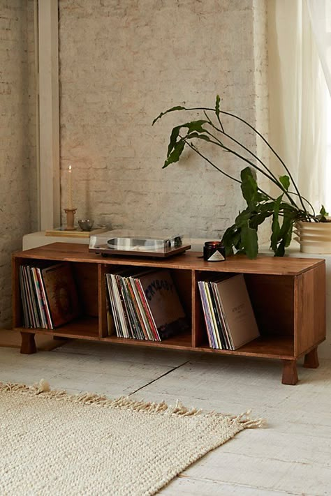 Minimal credenza in natural mango wood that's perfect as a storage unit or TV stand! Perfectly sized to store your favorite vinyl - up to 240 records' worth! Available exclusively at Urban Outfitters. Features Ema low media stand Low-slung silhouette Three open storage cubbies Verstaile - use it as a storage unit or as a TV stand Assembly required UO exclusive Content + Care Assembly required - instructions + hardware included Mango wood Wipe clean Imported Size Dimensions: 60" l x 17" h x 20.25 Table Next To Couch, L Shaped Couches, Low Credenza, Vinyl Record Room, Credenza Decor, Apartment Mood Board, Record Room, Living Room 2024, Wood Tv Console