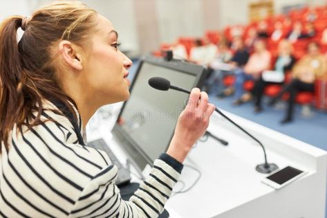 Orator giving speech on stage in convention center royalty free stock images Female Speaker, Giving Speech, The Orator, Convention Center, Convention Centre, On Stage, Stock Images Free, Coaching, Speaker