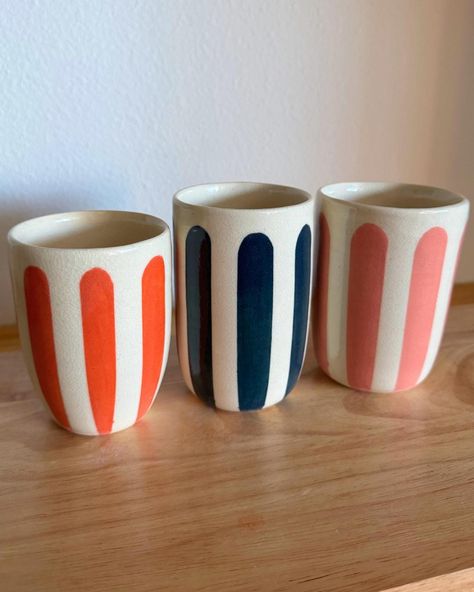 Handmade Ceramic Cups with colorful hand painted design! Please note: Each piece is 100% handmade. Variations in size, shape, and color are natural and add to the unique character of your piece, making every item truly one of a kind.  No two items are exactly alike, so please embrace the beauty of these slight differences. Please reference the video + photos to see each cup. You can select from the dropdown which one you want! Dimensions: 3-3.25" W x 4.25-4.5" H Capacity: 10-2 fl oz All pieces are intentionally handmade and quality checked before listing.  Glazed stoneware, fired at cone 6 (2200oF) - suitable for high & low temperature drinks, dishwasher safe, microwave safe.  Creation Process: Each product is 100% handmade. The shape is thrown on the pottery wheel using stoneware clay. On Ceramic Cups Handmade, Pottery Wheel, Stoneware Clay, Ceramic Cups, Handmade Pottery, Paint Designs, Handmade Ceramic, Handmade Ceramics, High Low