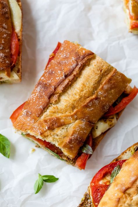 Fresh mozzarella and thick, ripe tomato slices are paired with a creamy pesto spread and basil in this summery caprese sandwich recipe. Pesto Mozzarella Sandwich, Caprese Sandwich Recipe, Mozzarella Sandwich, Holiday Meal Planning, Pesto Sandwich, Caprese Sandwich, Salmon And Shrimp, Slow Cooker Pasta, Creamy Pesto