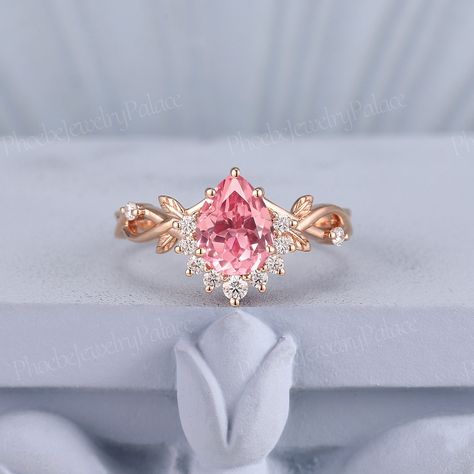 Vintage peach sapphire engagement ring delicate pear pink sapphire wedding ring solid gold rings unique handmade gift anniversary gift women PRODUCT SUMMARY Metal Type: yellow, white or rose solid 10K/14K or 18K gold. Size: All sizes are available, contact me if they do not contain the size you want in the drop-down menu. ☪☪Engagement ring ⚜Center Stone - lab grown pink paparacha sapphire Cut - pear Size - 6x8mm,about 1.3 ct ⚜Side Stone - Moissanite or diamond Cut - Round Weight - 0.185ct Clarit Unique Engagement Rings Pink, Pink Saphire Engament Ring, Pink Rings Engagement, Unique Rose Gold Engagement Rings, Pink Sapphire Wedding Ring, Pink Wedding Ring, Fairytale Engagement Rings, Wedding Rings Pink Sapphire, Pink Rings