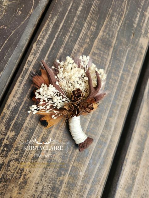 Custom Order For Racheal ❤️ Thank You! 
.
Brown Antler Boutonnieres with Preserved Babysbreath, Pampas Grass, Pinecones & Ivory Twine. 
.
WWW.KRISTYCLAIREFLORALDESIGN.COM 
WWW.KRISTYCLAIRE.ETSY.COM 
.
#weddingboutonniere #wedding #weddingideas #Antler #antlerart #brown #antlerdecor #faux #resin #pinecones #babysbreath #preservedflower #ivory #pheasant #pampasgrass #Groom #groomsmen #boutonniere #lapelpin #pin #corsage #buttonhole #idea #unique #holiday #country #barn #hunting #western #whitetail Western Wedding Corsage, Pheasant Wedding Decor, Country Boutonniere, Antler Boutonniere, Antler Wedding Decor, Deer Antler Wedding, Pin Corsage, Groomsmen Boutonniere, Antler Art