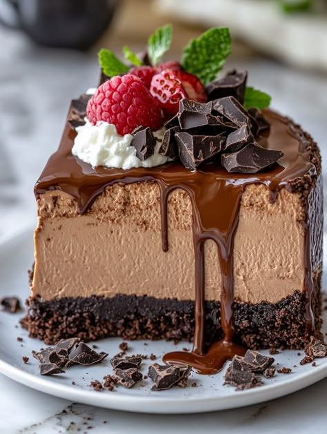 Triple Chocolate Mousse Cheesecake 🍬  🍬  Ingredients 🍬 For the crust: 1/4 cup unsalted butter, melted 🧈 2 cups Oreo crumbs 🍪 For the cheesecake: 1 cup semi-sweet chocolate chips, melted 🍫 1 cup sour cream 🥄 24 oz (680g) cream cheese, softened 🧀 1 teaspoon vanilla extract 🍦 1 cup granulated sugar 🍬 2 tablespoons cocoa powder 🍫 3 large eggs 🥚 For the chocolate mousse: 1/4 cup powdered sugar 1 1/2 cups semi-sweet chocolate chips 2 cups heavy cream, divided 🥛 1 teaspoon vanilla extract 🍦 Triple Chocolate Mousse, Chocolate Mousse Cheesecake, Mousse Cheesecake, Cheesecake Ingredients, Best Chocolate Desserts, Chocolate Raspberry Cake, Chocolate Egg, Chocolate Chip Cheesecake, Easy Cheesecake Recipes