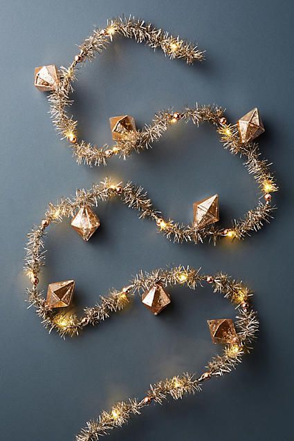 Anthropologie Blushing Tinsel Garland | Christmas Decor | Holiday Inspiration Gold Christmas Garland Ideas, Anthropologie Holiday Decor, Gold Christmas Garland, Christmas Tree Tinsel, Christmas Garland Ideas, Tree Tinsel, Pink Home Accessories, Rose Gold Christmas Tree, Rose Gold Christmas Decorations