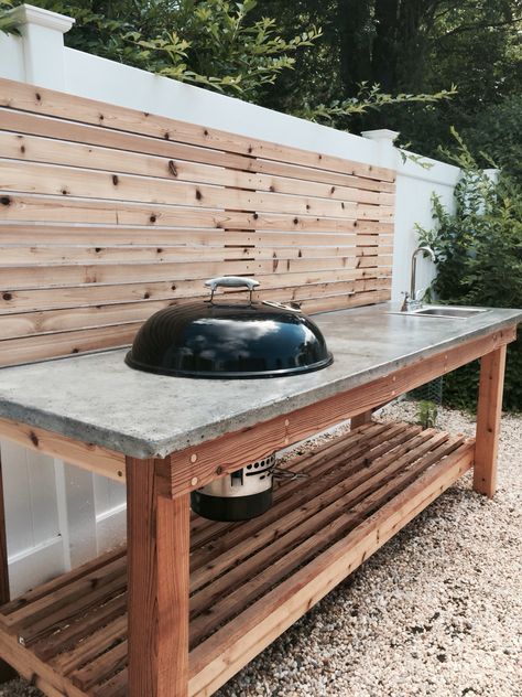 Cedar wood outdoor kitchen with a concrete countertop and built in Weber charcoal grill and sink. Outdoor Countertop, Concrete Outdoor Kitchen, Countertop Inspiration, Concrete Countertops Outdoor, Outdoor Grill Station, Outdoor Kitchen Countertops, Outdoor Kitchen Cabinets, Countertop Ideas, Grill Table