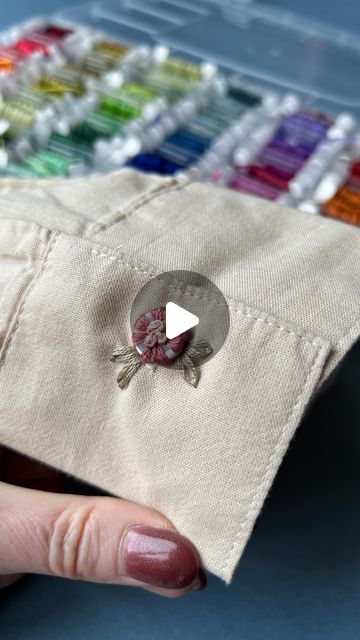 Jenny ~ Embroidery Art, Design & Crafts on Instagram: "Here’s another little button idea. 🌸 Do you like it? I have used the lazy Daisy stitch and French knots to secure the button, and it’s fully usable if you need to undo it.
.
.
#upcycledclothing 
#upcycledfashion 
#embroideredflowers 
#embroideredclothing 
#embroidereddenim 
#embroideredclothes 
#embroideredflorals 
#learntoembroider 
#mindfulart 
#slowstitching 
#sewingproject 
#embroiderypatterns 
#bordadolivre 
#createdtocreate 
#diycrafts 
#slowcraft 
#dmcthreads 
#dmcembroidery 
#springflowers 
#embroiderydesign 
#beginnerembroidery 
#embroiderywork 
#denimembroidery 
#sustainablefashion 
#embroiderhappyhoops 
#embroiderytutorial 
#embroideryprocess 
#embroideryproject 
#handsew" Button Embroidery Ideas, Button Designs Ideas, Embroidery Buttons, Button Embroidery, French Knot Stitch, Daisy Stitch, Trendy Sewing Projects, Learning To Embroider, Lazy Daisy Stitch