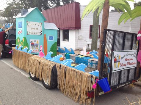 Santa’s Beach House Christmas parade float Endless Summer Realty- Saint Augustine Florida #realestate #paradefloat #cardboard Summer Themed Parade Floats, Beach Christmas Parade Float, Tropical Float Parade, Tropical Parade Float Ideas, Beach Themed Parade Float, Tropical Christmas Parade Float, Realtor Parade Float Ideas, Beach Theme Parade Float Ideas, Beach Floats Parade