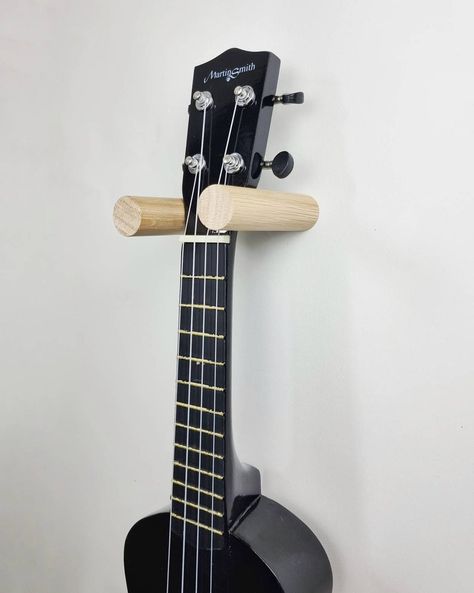 Guitar Wall Mount Ideas, Guitar Holder, Guitar Holder Wall, Ukulele On Wall, Ukulele Holder Diy, Hang Ukelele On Wall, Ukulele Holder Wall Mount, Guitar Wall Holder, Ukulele Holder