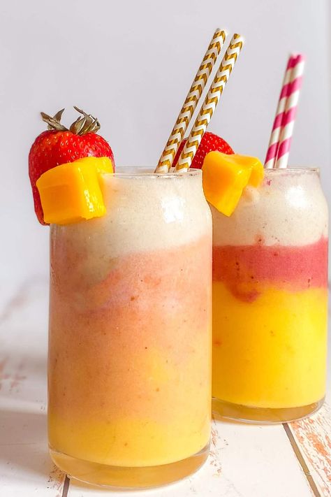 A delicious tropical banana mango strawberry smoothie is the perfect sweet treat. Make this smoothie in less than five minutes with only four ingredients! #smoothie #fruitsmoothie Strawberry And Mango Smoothie, Banana Strawberry Smoothie, Mango Strawberry Smoothie, Strawberry Mango Smoothie Bowl, Smoothie Banana Strawberry, Smoothie At Home, Mango Banana Strawberry Smoothie, Strawberry Mango Protein Smoothie, Strawberry Mango Smoothie