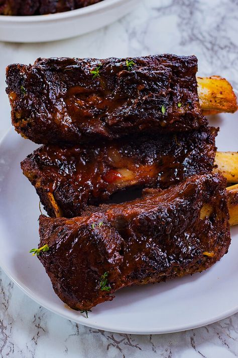 These easy oven baked jerk beef ribs are seasoned to the bone, slow braised, tender and juicy. These ribs will be a hit- fall off the bone perfection! Beef Ribs Crockpot, Jerk Beef, Baked Beef Ribs, Jerk Recipe, Bbq Beef Ribs, Beef Back Ribs, Ribs In Oven, Beef Ribs Recipe, Beef Short Rib Recipes