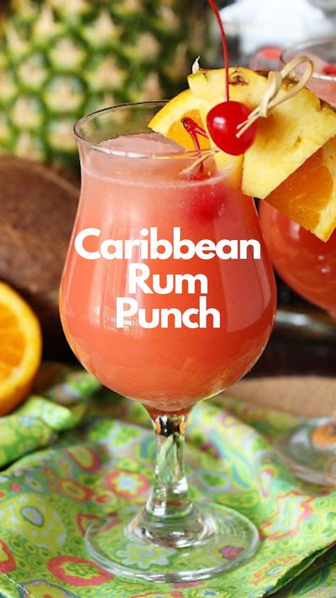 A true taste of the Caribbean, this punch recipe blends light and dark rum with pineapple juice and cream of coconut. Instead of orange juice, Caribbean rum punch uses triple sec and sweet and sour mix. There’s a lot going on in this cocktail, but it comes together into a creamy, sweet, and tart beverage. #CarribeanRumPunch Caribbean Sunset Rum Punch, Caribbean Punch Recipes, Carribean Rum Punch, Caribbean Rum Punch Recipe, Jamaican Rum Punch Recipes, Caribbean Rum Punch, Rum Punch Recipe, Easy Party Punch, Alcoholic Punch Recipes