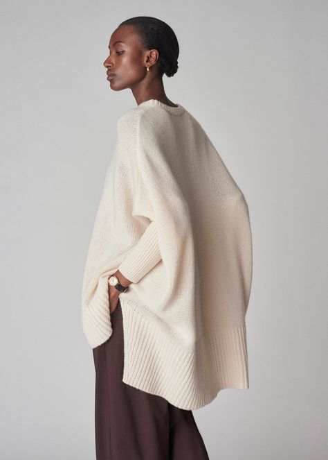 Wrap yourself in the luxurious softness with our poncho style sweater. Combining the sophistication of cashmere with a modern, relaxed silhouette. The fitted sleeves make it easy easy to move around in. Ribbed neck hem. Details 100% Cashmere Ivory 7701LNC-F24 Relaxed fit Model is 5'9" and wears a size small. Dreamy Fashion, Instagram Editor, Batwing Sweater, Fitted Sleeves, All White Outfit, Poncho Style, Cashmere Jumper, Color Crush, Style Sweater