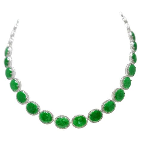 Introducing our exquisite Vintage Apple Green Color Jadeite Burmese Jade and Diamond Choker Necklace in 18 Karat White Gold. This stunning piece of jewelry exudes elegance and sophistication, capturing the essence of timeless beauty. The necklace features a collection of 17 vintage apple green color jadeite Burmese jade stones, carefully selected for their exceptional quality and captivating hue. The total weight of the diamond is 2.50 carats, adding a touch of natural beauty to the design. Accentuating the jadeite jade are sparkling diamonds, meticulously set in 18 Karat white gold, creating a brilliant and glamorous display. The diamonds enhance the overall elegance and add a captivating sparkle to the necklace. With a total length of 16 inches, this choker-style necklace gracefully sits Jade Jewelry Necklace, Apple Green Color, Burmese Jade, Antique Jade, Diamond Choker Necklace, Gold For Sale, Choker Style Necklace, Vintage Apple, Diamond Choker