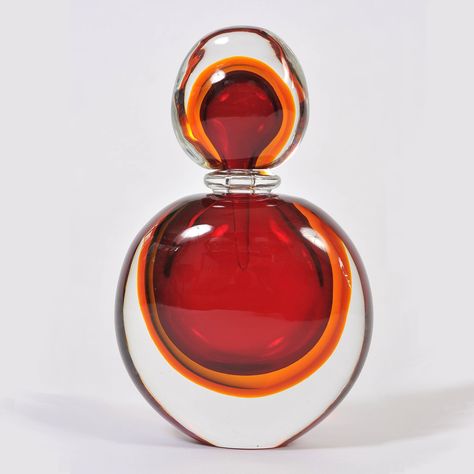 Super-sized perfume bottle and stopper in smoothly sculpted red, amber and clear Murano glass Size: 34cm high x 21cm wide x 11cm deep #murano #muranoglass #muranoperfumebottle #perfumebottle Jasmine Perfume, Pretty Perfume Bottles, Perfume Bottle Design, Perfume Bottle Art, Fragrance Bottle, Beautiful Perfume Bottle, Antique Perfume Bottles, Beautiful Perfume, Antique Perfume