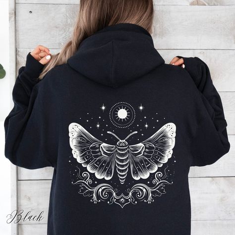 Cottagecore Celestial Moth Unisex Hooded Sweatshirt | Lunar Moth Hooded Sweatshirt | Mystical Moth Hoodie | Celestial Hoodie | Cottagecore Clothing | Dark Academia Apparel | Alternative Clothing | Aesthetic Hoodie  ✔️ Colour: Black ✔️ Design on front only, back only, or both sides ✔️ Soft, warm and cozy heavy blend unisex hoodie  ✔️ Classic Fit ✔️ Fiber composition: 50% Cotton, 50% Polyester ✔️ Medium-heavy fabric (8.0 oz/yd² (271 g/m   ✔️ Spacious kangaroo pouch pocket  ✔️ Adjustable hood with Moth Hoodie, Goblincore Clothes, Alt Clothes, Cowgirl Aesthetic, Luna Moth, Limassol, Supply Chain, Zip Up Hoodie, Graphic Hoodies