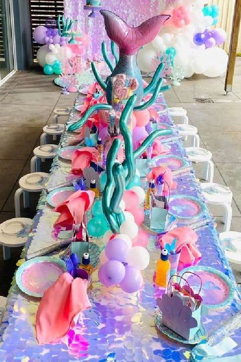 Take a look at this beautiful mermaid birthday party! The table settings are wonderful!! See more party ideas and share yours at CatchMyParty.com Mermaid Birthday Party Table Decorations, Under The Sea Birthday Party Ideas, Undersea Decorations, Mermaids Birthday Party, Mermaid Party Favors Bags, Mermaid Pool Party, 4de Verjaardag, Mermaid Pool Parties, Ariel Birthday Party