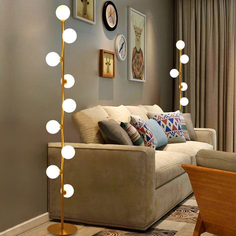 Offering a boost of brightness and a splash of contemporary style, this floor lamp is perfect for breathing new life into any layout. This tree floor lamp is founded atop a metal base that lets you easily tuck it into narrow nooks and unused corners. A solid finish outfits the slender metal body for a minimalist touch. Up above, spherical shades are designed for a mid-century-inspired look.   - Material: Metal, Glass - Finish: Gold - Overall Height: 60.6" (1540mm) - Diameter of Light Fixture: 9. Tree Floor Lamp, Floor Lamps Living Room, White Floor Lamp, Room Lamp, Standing Lamp, Modern Floor Lamps, Lamps Living Room, My New Room, Glass Globe