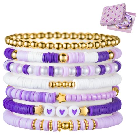 PRICES MAY VARY. Purple Stackable Bracelets: Elevate your accessory with our purple heishi bead bracelet set, featuring seven unique pieces that add flair to any ensemble. Five bracelets boast a captivating blend of gold-plated beads, purple and white clay beads, while one alternates between pearl beads and purple clay beads. The final piece features a string of gold-plated round beads, completing this stunning collection. Crafted with Care: Our purple friendship bracelets are carefully strung f Cute Clay Bead Bracelet Ideas For Mom, Clay Bead Brackets Ideas, Stitch Beaded Bracelet, Friends Themed Bracelets, Braclets Ideas Clay Beads Easy, Purple Beads Bracelets, Cute Clay Bead Ideas, Clay Bracelet Ideas Purple, Clay Bead Bracelet Ideas Blue And Purple