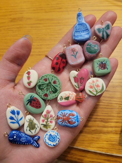 These beautifully detailed, meticulously painted handmade clay charms are perfect for adding some flare to any outfit! Fall Air Dry Clay Crafts, Small Useful Gifts, Clay Pendent Designs, Clay Bag Charm, Air Dry Clay Letters, Clay Ideas Magnets, Diy Crafty Gifts, Handmade Christmas Gift Ideas Diy Crafts, Handmade Clay Necklace