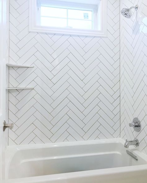 Sarah | Home on Two Acres on Instagram: “Here’s our Jack n Jill bathtub! I love the way the herringbone tile turned out! 😍 We had to do marble corner shelves in here because two of…” Herringbone Shower Tub Combo, Herring Bone Bathroom Tile, Bathtub Corner Shelves, Herringbone Tile Tub Surround, Herringbone Tub Surround, White Herringbone Bathroom, Harringbone Tile, White Herringbone Tile Bathroom, Herringbone Shower Tile