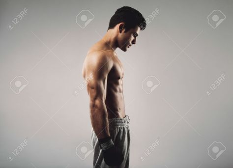 Side view of fit young man wearing boxing gloves looking down on grey background Stock Photo - 29385741 Human Body Poses, People For Drawing, Sketchbooks Inspiration, Side View Drawing, Anatomy Male, Man Pose, Profile Photography, Drawing Male, Male Pose Reference