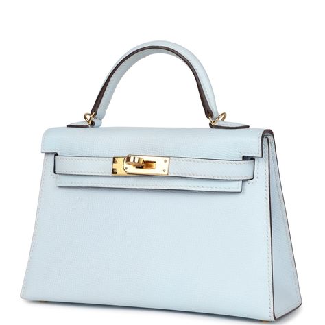 This Kelly, in the Sellier style, is in Bleu Brume epsom leather with gold hardware and has tonal stitching, two straps with front toggle closure, single rolled handle and removable shoulder strap.The interior is lined with Bleu Brume lambskin leather and has one open pocket on the back wall.Collection: YOrigin: FranceCondition: New and never worn (plastic on hardware)Accompanied by: Hermes box, Hermes dustbag, shoulder strap, shoulder strap dustbag, feltMeasurements: 7.5" width x 4.5" height x 2.2" depth; 2.5" handle drop (18" shoulder strap drop) Blue Birkin, Hermes Collection, Kelly Hermes, Hermes Kelly Sellier, Kelly Sellier, Mini Kelly, Blue Handbag, Hermes Kelly Bag, Luxury Bags Collection