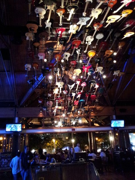 Guitars over the staircase in Hard Rock Cafe - Honolulu Resturant Decor, Hardrock Cafe, Bicycle Garage, Boat Bar, Rock Wedding, Backyard Bar, The Staircase, Rock Of Ages, Dive Bar