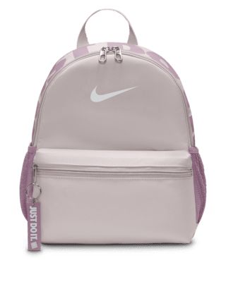 A small but mighty bag, the Nike Brasilia JDI Backpack is just the bag for wherever your day takes you. Perfect for hanging out with friends or adventuring around town, this bag features a spacious double-zippered main compartment for the essentials and a smaller front pocket for the small stuff that you need to grab quickly. Shown: Platinum Violet/Plum Dust/White Style: DR6091-019 Nike Brasilia Backpack, Nike Mini Backpack, Backpack Nike, Nike Bag, Nike Backpack, Small Stuff, Mini Backpack, Christmas Wishlist, White Style