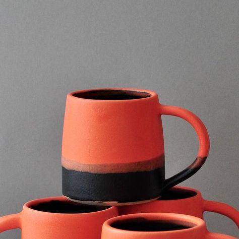 Joanna Oliver on Instagram: "White stoneware espresso mugs finished in Kate’s Hot Orange and Stuart Carey’s Black glazes. I reopened the shop yesterday but these are all sold out now. Thank you shoppers for your patience and support #potters #studiopotter #potterslife #bowls #stoneware #ceramics #pottery #mugs #jugs #contemporaryceramics #designermaker #wheelthrown #pottersofinstagram #glazemagic #simple #handmade #madeinoxfordshire" Fall Pottery, Espresso Mugs, Ceramics Pottery Mugs, Orange Mugs, Hot Orange, Instagram White, Stoneware Ceramics, Ceramics Pottery, Pottery Making