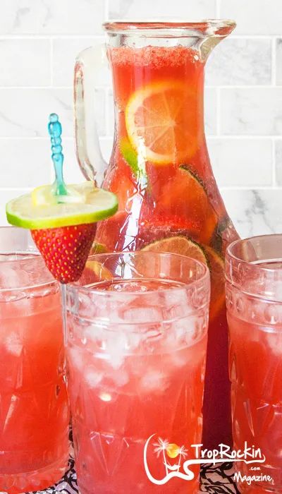 Strawberry Rum Punch Recipe (So Easy!) | Trop Rockin Bahamas Drinks, Strawberry Rum Drinks, Easy Rum Punch, Summer Rum Drinks, Rum Punch Drink, Caribbean Rum Punch, Cocktails Strawberry, Ginger Ale Drinks, Strawberry Daiquiri Mix