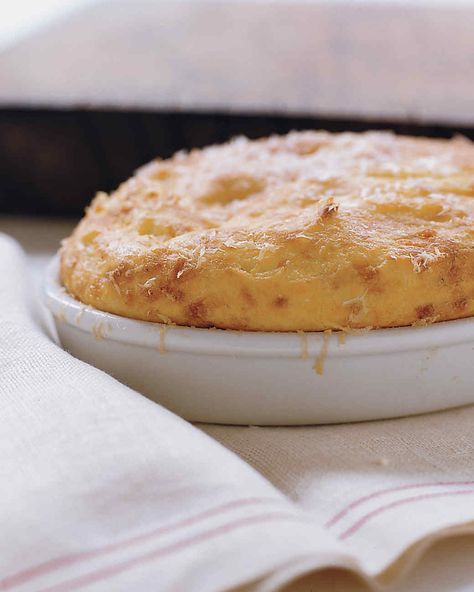 Seasoned with garlic and lightened with egg whites, a potato souffle is delightfully puffy out of the oven. Potato Souffle, Parmesan Cheese Potatoes, Local Milk, Souffle Recipes, Chocolate Souffle, Gratin Dish, Asparagus Salad, French Cooking, Julia Child