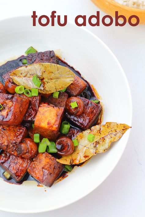 delicious Filipino tofu adobo with savory sauce and laurel leaves in a white bowl garnished with green onion slices Tofu Adobo, Vegan Filipino, What Is Tofu, Best Tofu, Great Vegan Recipes, Vegan Asian Recipes, Filipino Dish, Adobo Recipe, Vegetarian Chicken