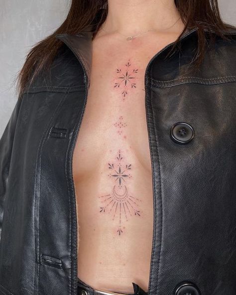 Emily ☾ Celestial Tattooist on Instagram: "Sternum and chest embellishments for the loveliest lady 💫✨ . . . . #finelinetattoo #fineline #sternumtattoo #ornamental #ornamentaltattoo #moontattoo #celestialtattoo #leeds #hydeparkleeds #tattooleeds #leedstattoo #delicatetattoo #femininetattoo #smalltattoo #tinytattoo" Celestial Stomach Tattoos, Sparkle Tattoo Sternum, Decorative Chest Tattoo, Sternum Sparkle Tattoo, Chest Sparkle Tattoo, Ornamental Tattoo Chest Women, Chest Sternum Tattoo Female, Celestial Ornamental Tattoo, Sparkle Tattoo Chest