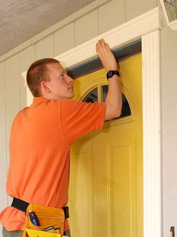 Decorative trim around a doorway is a quick, easy, and cost-effective way to add curb appeal. Learn how to install it in one day. Exterior Door Trim, Installing Exterior Door, Front Door Trim, Door Makeover Diy, Garage Door Types, Trendy Door, Add Curb Appeal, Front Door Makeover, Stained Glass Door