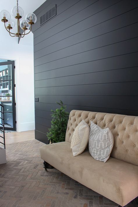 modern black shiplap wall Black Mudroom, Black Shiplap Wall, Brick Herringbone Floor, Brick Herringbone, Shiplap Living Room, Black Shiplap, Herringbone Floors, Painting Shiplap, Black Paint Color