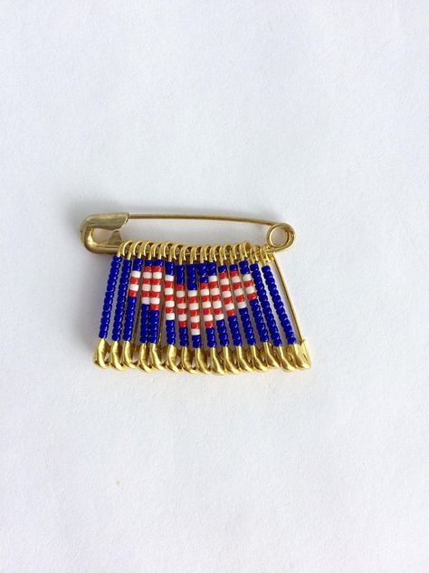 Check out this item in my Etsy shop https://www.etsy.com/listing/577650186/usa-flag-pin4th-of-july-pinfathers Safety Pin Jewelry Patterns, Bead Pins, Friendship Pins, Safety Pin Art, Beaded Pins, Safety Pin Crafts, American Flag Pin, Flag Beads, Safety Pin Jewelry