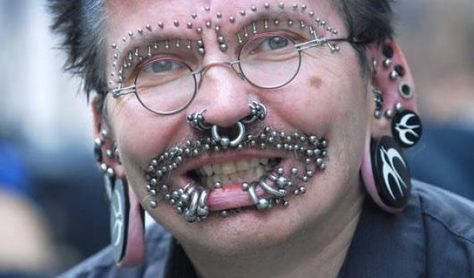 Rolf Buchholz has over 100 piercings around his face and almost 300 in the genital area. He also has a full body suit tattoo. Rolf never flies. Body Peircings, Crazy Piercings, Good Morning Funny Pictures, Face Piercings, Best Tattoos For Women, Guinness Book, Facial Piercings, Body Piercings, Body Modifications