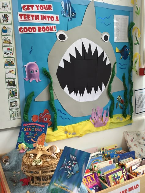 Shark book area (under the sea) Shark Bulletin Board Ideas, Under The Sea Reading Corner, Shark Bulletin Board, Ocean Theme Reading Area, Under The Sea Bulletin Board Ideas, Under The Sea Book Corner, Ocean Book Fair Theme, Ocean Theme Library, Under The Sea Book Fair