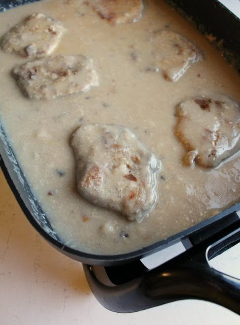 Pork chops and mushroom soup gravy are comfort food at its best. This easy electric skillet meal is a great way to feed your family and fill them up! Pork Chops And Mushroom Soup, Pork Chops In Mushroom Soup, Mushroom Soup Gravy Recipe, Mushroom Soup Gravy, Pork Stuffing, Mushroom Soup Pork Chops, Stuffing Easy, Food Slow Cooker, Skillet Pork Chop Recipes