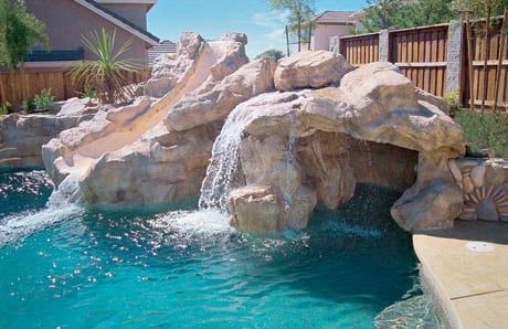 Ten affordable swimming pool grotto designs—in pictures—for your backyard Backyard Landscaping Ideas With Pool, Pool Rock Waterfall, Blue Haven Pools, Swimming Pool Waterfall, Swimming Pool Pictures, Swimming Pool Photos, Rock Waterfall, Custom Swimming Pool, Pool Water Features