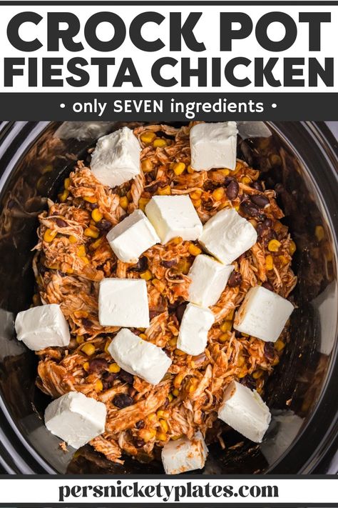 Slow cooker fiesta chicken is made with fall-apart tender chicken breasts, black beans, corn, zesty salsa, and cream cheese, with plenty of taco seasoning. It's an easy and versatile recipe that you can serve over rice or make different meals out of - burritos, tacos, nachos, you name it! | www.persnicketyplates.com Chicken Corn Cream Cheese Crockpot, Chicken Black Beans Corn Cream Cheese Crockpot, Slow Cooker Fiesta Chicken, Crock Pot Fiesta Chicken, Fiesta Ranch Chicken Crockpot, Chicken Black Beans Corn Crockpot, Cream Cheese Salsa Chicken, Southwest Chicken Crockpot, Crockpot Fiesta Chicken