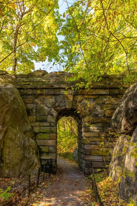 A rustic bridge between two rock outcropping with a narrow walkway in Central Park. Nyc Vacation, Old Bridges, European Village, Haunted Castle, Stone Masonry, Stone Arch, Vantage Point, Natural Bridge, Haunted Places