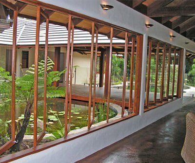 Tropical Windows, Modern Patio Doors, Folding Sliding Doors, Minimal Windows, Door And Window Design, Wooden Sliding Doors, Wooden Trim, Sliding Folding Doors, Fence Doors