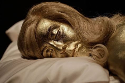 A recreation of the actress Jill Masterson covered in gold paint in the famous scene from Goldfinger Jill Masterson, Body Painting Men, Orange Two Piece, James Bond Theme, James Bond Girls, Ursula Andress, 007 James Bond, Movies Worth Watching, Painting Words