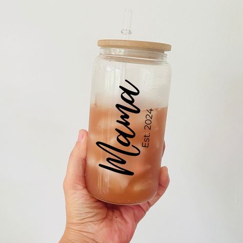 This Personalized Mama Glass Can make the perfect First-time or expecting mom gift! The glass tumbler can be customized with your text of choice. All our glass tumblers are permanently printed onto the surface. Designs will not fade, peel, or come out in the wash. DETAILS: * Dishwasher-safe Glass can. 16 fl. oz * Glass straw and bamboo lid. * Made with high-quality food-grade glass available in frosted or clear finish. * Each tumbler comes packaged in a white box. CARE INSTRUCTIONS: * Tumbler is First Time Mom, Expecting Mom Gifts, Glass Tumblers, Tumbler Personalized, Mom Tumbler, Glass Straws, High Quality Food, Custom Glass, White Box