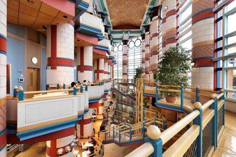 Inside the Judge Business School, Cambridge, designed by John Outram, which has received a Grade II* listing. © Historic England English Architecture, Brick Arch, University Of Cambridge, British Government, Colourful Buildings, Pitched Roof, Modern Buildings, Architecture Firm, Business School